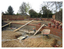 Landscaping – building retaining walls.  Levels were made up using good quality screened topsoil with added compost.  Garden landscaping design in Harpenden.