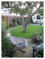 View from small patio in autumn.  Design for a small garden in Bedfordshire.