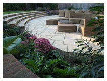 Looking across lower patio - large family garden in Harpenden, Hertfordshire.